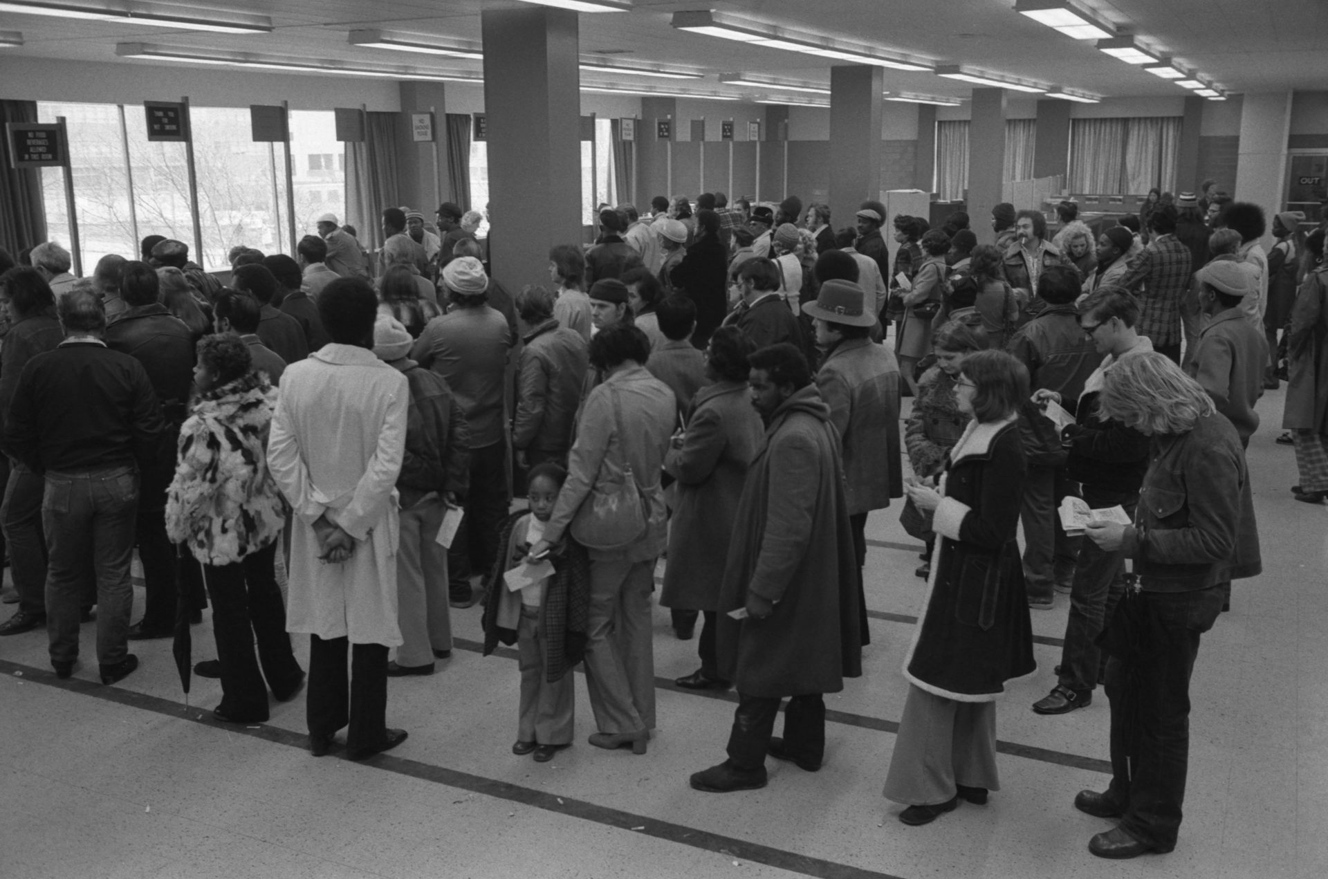 People line up at the Baltimore City Welfare Office in 1975